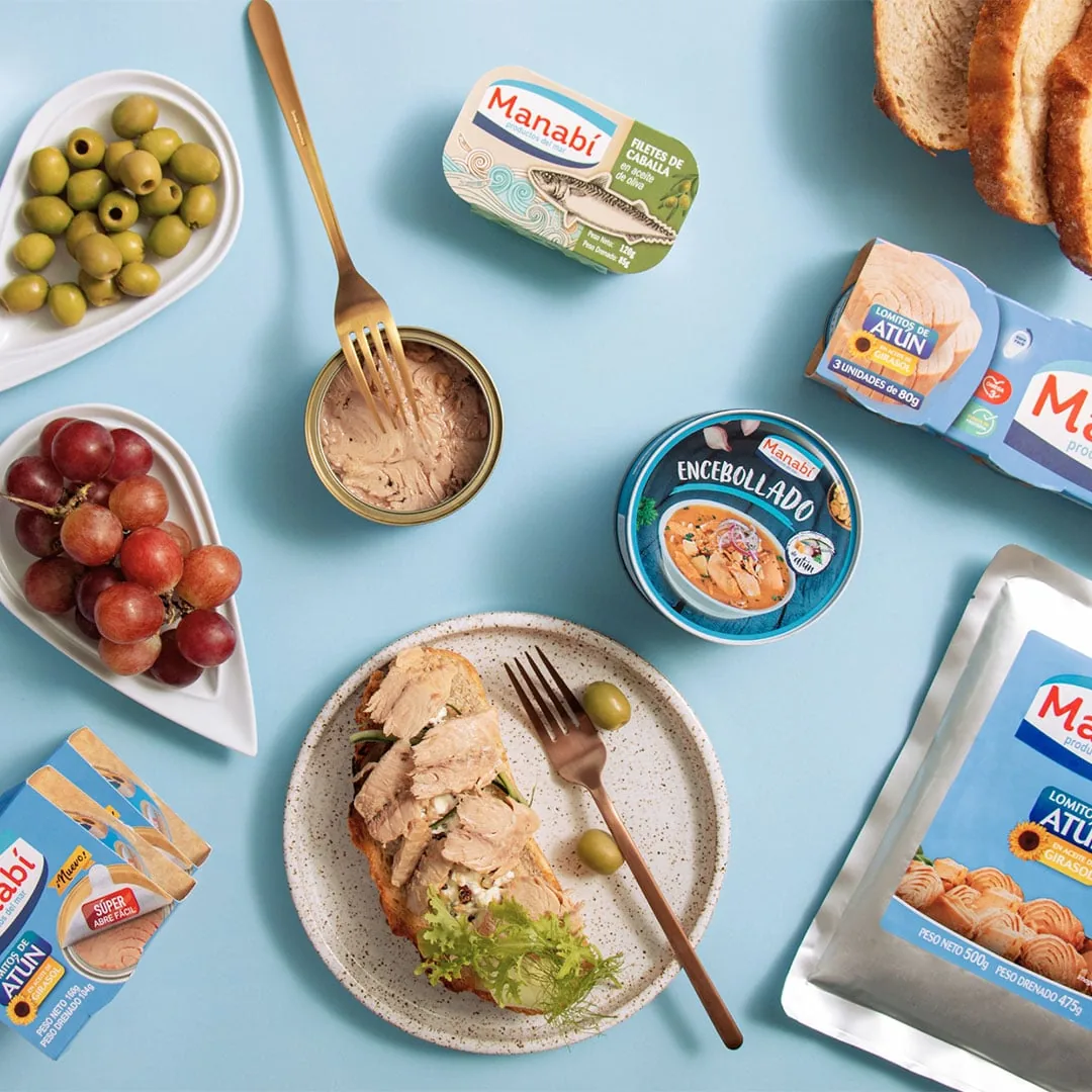 Canned tuna in cans and pouches with served dishes