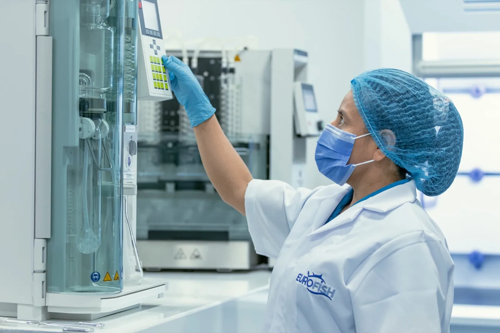 Quality technician auditing laboratory processes at a tuna plant